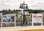 Dual Amtrak/ CT Rail signs on the station platform.